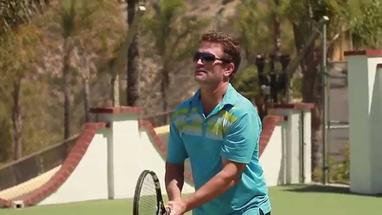 Coach and player during an on-court tennis session