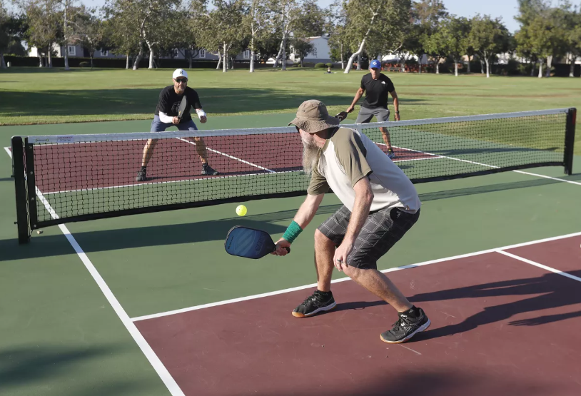 Pickleball player preparing to hit a shot on court